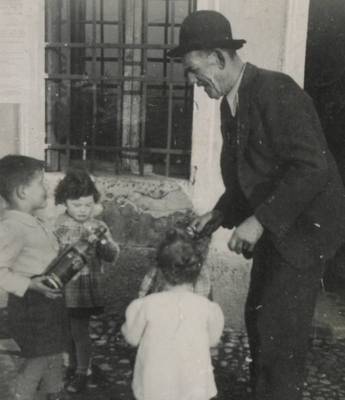 A series of pictures of Giovanni Poli while introducing his nephews to Grappa