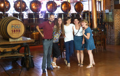 Barmaids visiting the Poli Distillery